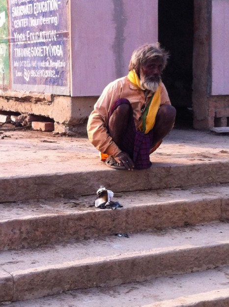 Man Resting at the Ghats Along the Ganges in Vanarasi, India