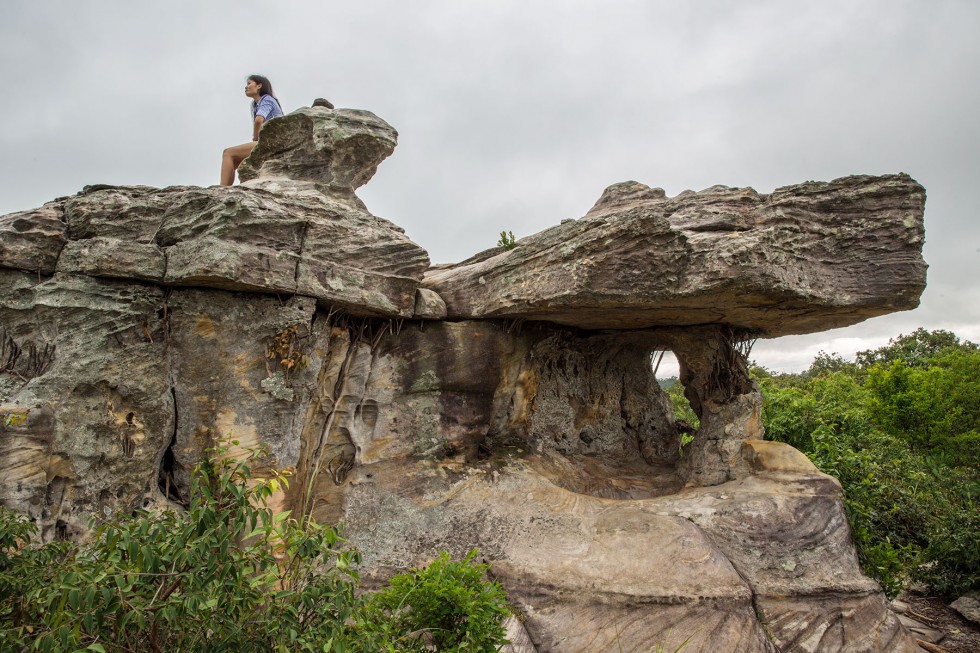 People climbing around the formations